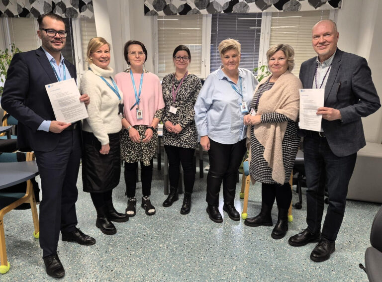 Samiedun ja Spesian edustajien yhteiskuva